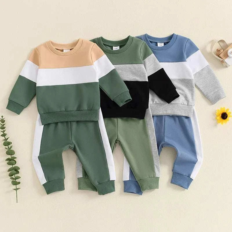 Set of toddler baby boy girl clothes with color block long sleeve sweatshirts and drawstring pants in green, black, and blue tones for fall and winter.