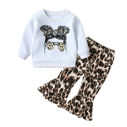 Toddler girls 2-piece cotton outfit with white long sleeve top featuring a girl with leopard print sunglasses and leopard print ruffle pants for spring and autumn.