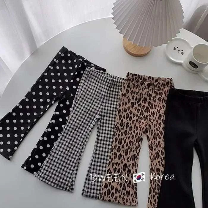 Solid Color Children's Leggings with various patterns including polka dots, checkered, leopard print, and solid black, suitable for kids aged 7-13 years.