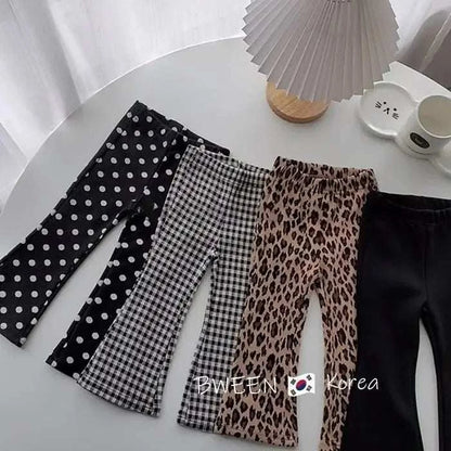 Solid Color Children's Leggings with various patterns including polka dots, checkered, leopard print, and solid black, suitable for kids aged 7-13 years.